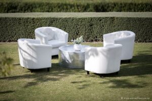 Pre-drinks furniture. White leather seating for cocktail hour lounge pockets