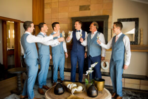 Groom and groomsmen enjoying champagne